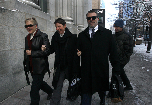 Scott Sommerdorf   |  The Salt Lake Tribune
Laurie Wood, left, and Kody Patridge enter U.S. District Court, Wednesday December 4, 2013, where  Judge Robert J. Shelby will hear arguments in the lawsuit brought by three couples, who argue Utah's ban on same-sex marriage is unconstitutional. The man on the right is unidentified.