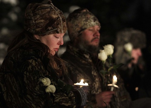 Leah Hogsten  |  The Salt Lake Tribune
Melissa Harris, left, and her husband Brandon mourn the loss of her daughter Kaslee, who died two years ago.  Friends and family whose infants and young children have died, gathered at the Christmas Box Angel statue in the Salt Lake City Cemetery for a candlelight vigil in remembrance, December 6, 2013.