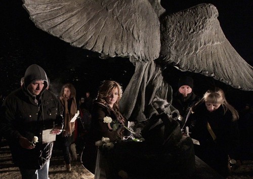 Leah Hogsten  |  The Salt Lake Tribune
Friends and family whose infants and young children have died, gathered at the Christmas Box Angel statue in the Salt Lake City Cemetery for a candlelight vigil and to lay flowers at the angels feet in remembrance of their loved ones, December 6, 2013.