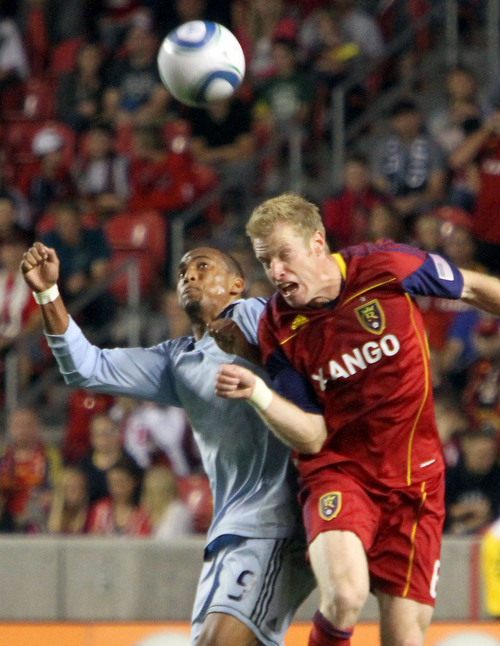 Real Salt Lake defender Nat Borchers, right, fights Sporting Kansas City forward Teal Bunbury for the ball in the first half at Rio Tinto Stadium.
Stephen Holt/ Special to the Tribune