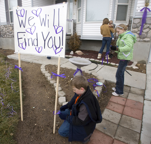Al Hartmann  |  The Salt Lake Tribune  1/26/2110
Friends and family of Susan Powell put purple ribbons around her home and signs saying that she is loved, missed and that she will be found.