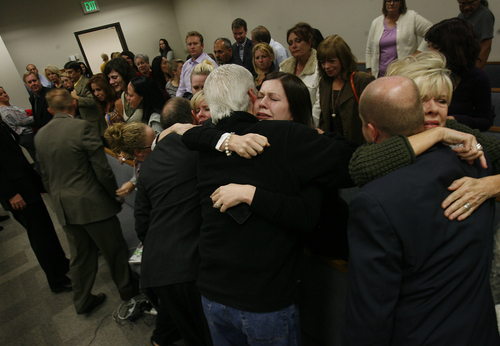 Scott Sommerdorf   |  The Salt Lake Tribune
Alexis Somers, center, and other family members embrace after the court adjourned following the verdicts against Martin MacNeill were given. Martin MacNeill was found guilty of murder and obstruction of justice early Saturday morning, November 9, 2013.