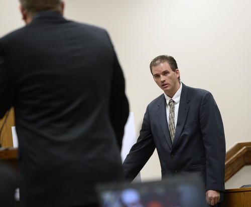 Al Hartmann  |  The Salt Lake Tribune
Orem Police Cpl. William Crook testifies at Conrad Truman's preliminary hearing in Fourth District Court in Provo Friday December 6.  He was first officer to scene.  Truman is charged with the murder of his wife Heidi Truman in September 2012 and obstruction of justice.