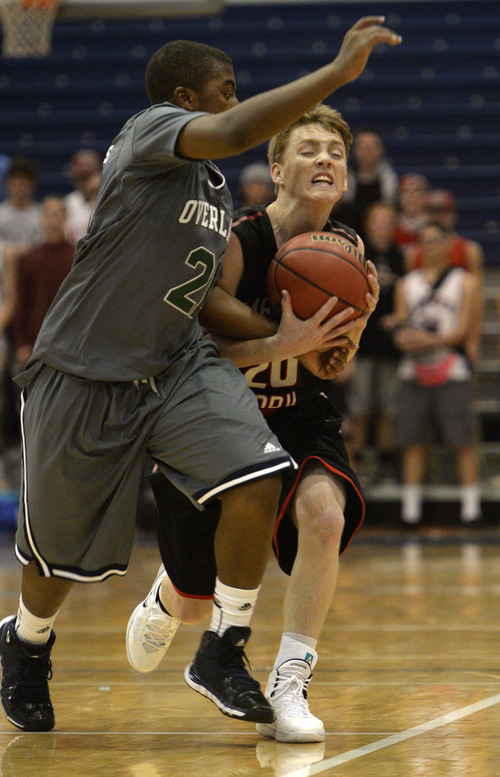 Rick Egan  | The Salt Lake Tribune 

America Fork's Braden Condie (20) gets tangled up with Reggie Gibson (21) of the Trailblazers, in prep basketball action, American Fork vs. Overland, Colorado  boys' basketball game, in the Great Western Shootout, at Orem High, Friday, December 6, 2013.