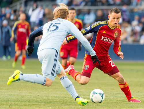Trent Nelson  |  The Salt Lake Tribune
Real Salt Lake's Luis Gil (21) and Sporting KC's Seth Sinovic (15) compete for the ball as Real Salt Lake faces Sporting KC in the MLS Cup Final at Sporting Park in Kansas City, Saturday December 7, 2013.