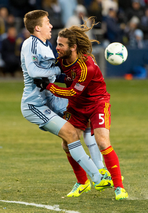 Trent Nelson  |  The Salt Lake Tribune
Real Salt Lake's Kyle Beckerman (5) collides with Sporting KC's Matt Besler (5) as Real Salt Lake faces Sporting KC in the MLS Cup Final at Sporting Park in Kansas City, Saturday December 7, 2013.