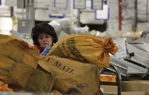 Leah Hogsten  |  The Salt Lake Tribune
The United States Postal Service's Salt Lake City main processing center will process over 1.2 million postmarks on the busiest shipping day of the year,  Monday, Dec. 16. Some 800 employees process some 2.4 billion pieces of mail annually and expect a 16% increase in packaging volume in Salt Lake City this holiday season. 
December 10, 2013.