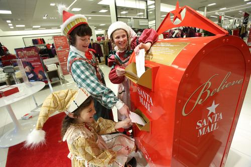 Francisco Kjolseth  |  The Salt Lake Tribune
Young actors Abigail Scott, below, and Brigham Inkley and Maggie Scott mail their letters to Santa at the Macy's store in downtown Salt Lake City. The trio of elves are part of the cast for Pioneer Theatre's latest production of "Elf."