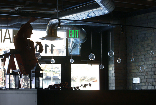 Scott Sommerdorf   |  The Salt Lake Tribune
Restaurant staff hangs Christmas decorations at The Annex, a new gastropub by the same folks who own Epic Brewing.