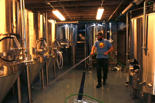 Scott Sommerdorf   |  The Salt Lake Tribune
Epic Beer brewer Kevin Crompton hoses down the freshly built brewing floor underneath The Annex, a new gastropub by the same folks who own Epic Brewing.