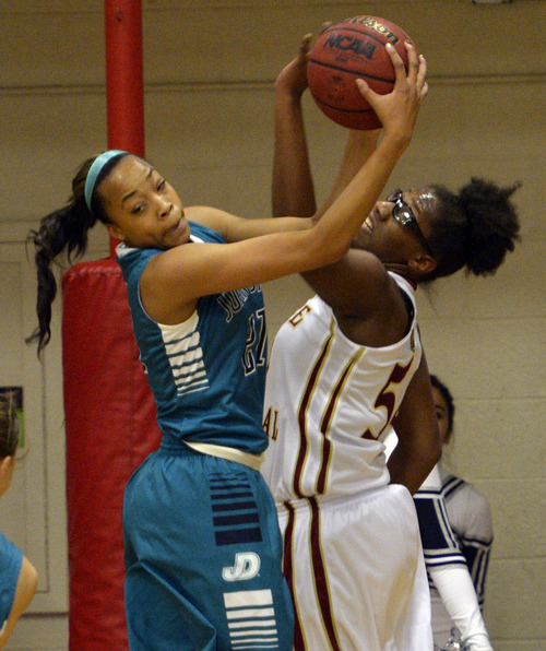 Rick Egan  | The Salt Lake Tribune 

Monique Mills (21), Juan Diego, goes for the ball along with Vennessa Austin (54) of the  Bulldogs, in prep basketball action at Judge Memorial, Monday, December 9, 2013.