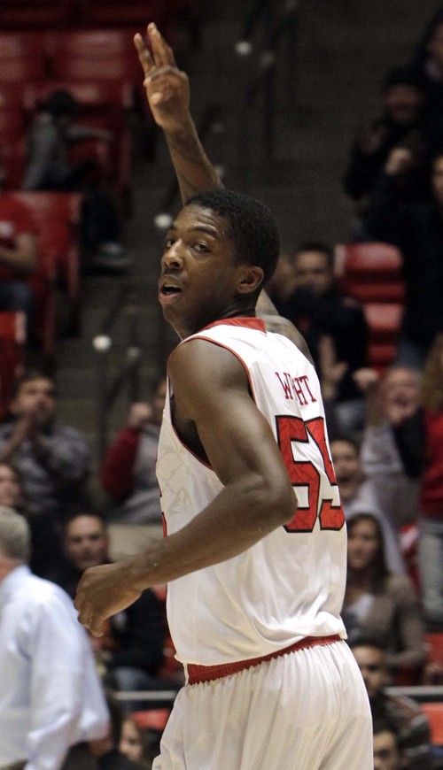 Leah Hogsten  |  The Salt Lake Tribune
Utah Utes guard Delon Wright signals his three-point net with the roar of the crowd. University of Utah defeated Idaho State Bengals
74-66, December 10, 2013 at the Huntsman Center.