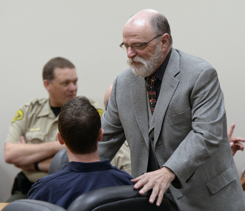 Al Hartmann  |  The Salt Lake Tribune
Defense lawyer Ron Yengich talks to his client Conrad Truman in 4th District Court in Provo Friday December 6 during a preliminary hearing in the murder of his wife, Heidy Truman, in September 2012 and obstruction of justice.