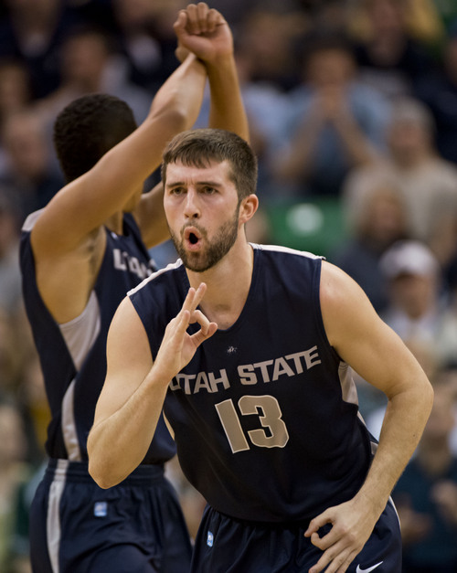 Lennie Mahler  |  The Salt Lake Tribune
Utah State's Preston Medlin celebrates after scoring three points against BYU in the first half of their game at EnergySolutions Arena in Salt Lake City, Saturday, Nov. 30, 2013.