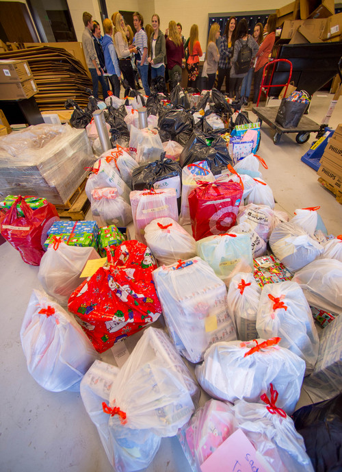 Trent Nelson  |  The Salt Lake Tribune
Students in Corner Canyon High School's Peer Leadership Team coordinated the donations of $15,000 worth of Christmas gifts that will be given to 200 disabled individuals by the Utah Association for the Intellectually Disabled (UAID). They loaded the items into a truck for delivery Thursday December 12, 2013 in Draper. UAID is still looking for donations to cover  Christmas for another 400 individuals.