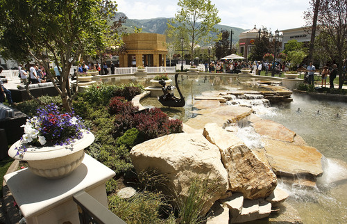 Leah Hogsten  |  The Salt Lake Tribune
The multimillion-dollar, 5,000-square-foot fountain features six fine-art bronze statues, created by sculptor Brian Keith that were dedicated Friday, June 15, 2012 in Farmington. The Station Park shopping center in Farmington unveiled a world-class show fountain with choreographed lights, music, color and 30-60-foot high dancing water.