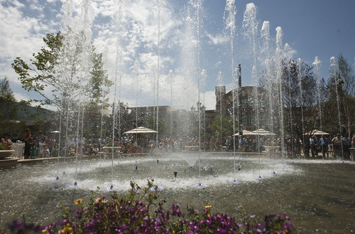 Leah Hogsten  |  The Salt Lake Tribune
The multimillion-dollar, 5,000-square-foot fountain that will run every hour was dedicated Friday, June 15, 2012 in Farmington.  The Station Park shopping center in Farmington unveiled a world-class show fountain with choreographed lights, music, color and 30-60-foot high dancing water.