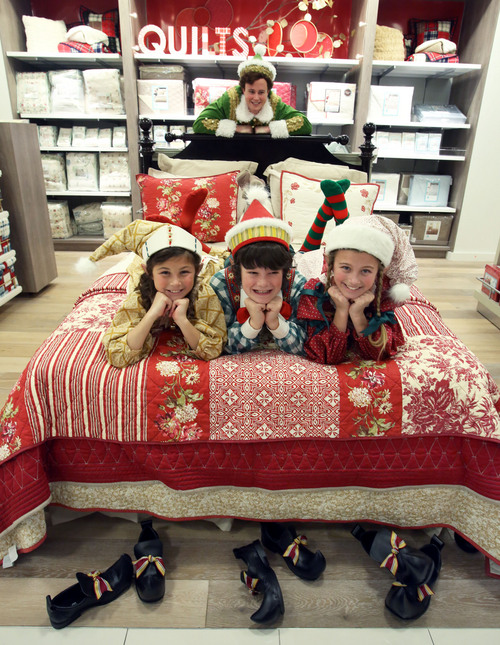 Francisco Kjolseth  |  The Salt Lake Tribune
Young actors Abigail Scott, Brigham Inkley and Maggie Scott, from left, join Quinn VanAntwerp as Buddy the "Elf," at Macy's downtown to promote Pioneer Theatre's latest holiday production.