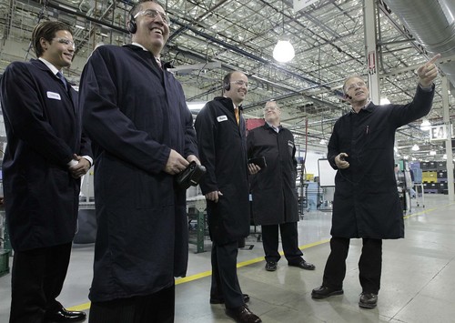 Leah Hogsten  |  The Salt Lake Tribune
Autoliv plant manager Brian Hyde (far right) draws a laugh from l-r Vincent Mikolay, with the Governor's Office of Education, Jon Pierpont, Exec Dir. of Workforce Services, Lt. Governor Spencer Cox, and Autoliv tech support manager Peter Rathjen.  Bridgerland Applied Technology College students training in industrial automation toured the AutoLiv plant in Brigham City to learn about the company's sophisticated robotic equipment, December 12, 2013.