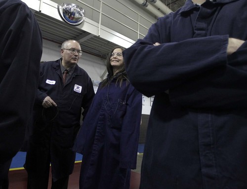 Leah Hogsten  |  The Salt Lake Tribune
 Bridgerland Applied Technology College student Rachel Johnson (right) and department head Ed Ball tour Autoliv and learn about the company's programable launch controllers and the relation to the school's robotics program.  Bridgerland Applied Technology College students training in industrial automation toured the AutoLiv plant in Brigham City to learn about the company's sophisticated robotic equipment, December 12, 2013.