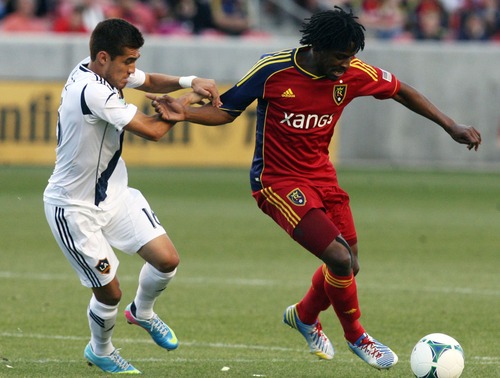 Kim Raff  |  The Salt Lake Tribune
(right) Real Salt Lake midfielder/defender Lovel Palmer (7) tries to maintain control of the ball as (left) Los Angeles Galaxy midfielder Hector Jimenez (16) defends during the first half at Rio Tinto in Sandy on April 27, 2013. Real Salt Lake lost the game 2-0.