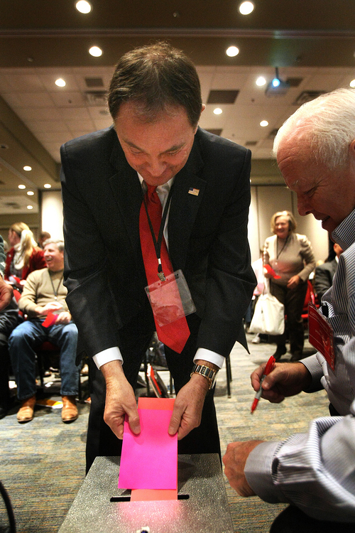 Scott Sommerdorf   |  The Salt Lake Tribune
Utah Governor Gary Herbert votes in one of five seperate ballots as The Republican State Central Committee met to choose three names to send to the Governor to replace AG John Swallow. After five ballots they chose: Sean Reyes, Robert Smith, and finally Brian Tarbet, Saturday December 13 2013.