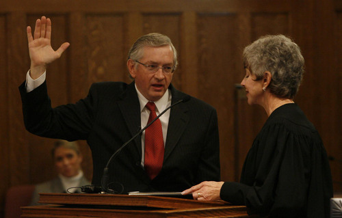 Utah Attorney Clark Waddoups (left) is sworn into the U.S. District Court by Chief Judge Tena Campbell. Utah Attorney Clark Waddoups was sworn in as Utah's 15th U.S. District judge at the Frank Moss US Courthouse Thursday. Waddoups was appointed to the bench on Oct. 21, 2008 by President George Bush.  
Photo by Leah Hogsten/ The Salt Lake Tribune
[city} 11/6/08