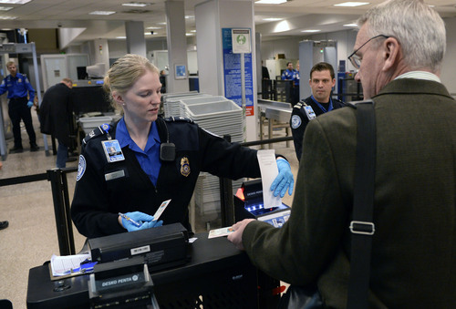 Al Hartmann  |  The Salt Lake Tribune
TSA agent Cindy Briggs scans a passenger's PreCheck boarding pass that allows the traveler to skip having to remove belts, shoes, and light coats and opening laptops to speed up the security screening process.