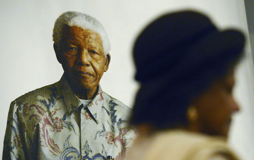 Steve Griffin  |  The Salt Lake Tribune

The public gets a close look at an original oil painting of Nelson Mandela by artist Robert McCurdy during a service to Remember, Reflect and Celebrate the life of Nelson Mandela at The Cathedral Church of St. Mark in Salt Lake City Sunday, December 15, 2013. The service will was a quiet, reflective service with prayer, silent reflection, music, and poetry.