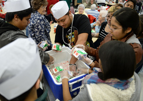 Francisco Kjolseth  |  The Salt Lake Tribune
Kearns High school Latinos in Action pitch in to hand out meals at the Salt Lake County senior center in Kearns on Tuesday, Dec. 17, 2013. The event is part of a Salt Lake County division of Aging Services holiday tradition to give back to our seniors who have helped build our communities and remain active members today.