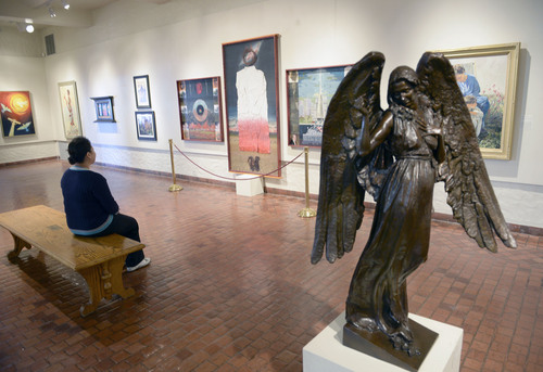 Al Hartmann  |  The Salt Lake Tribune
Person takes in the Springville Art Museum's annual Spiritual Art exhibit.