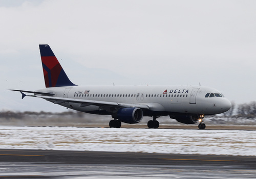 A Delta plane takes-off at the Provo Airport on December 19, 2013 in Provo, Utah. Several Delta flight were diverted and landed at the Provo Airport after the Salt Lake City a Airport was closed standing several hundred passengers.  (Photo by George Frey  |  Special to the Tribune)