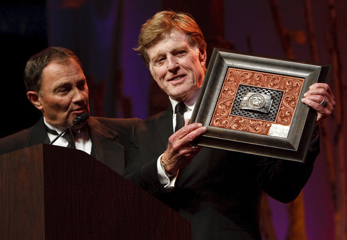 Leah Hogsten  |  The Salt Lake Tribune
Gov. Gary Herbert, left, presents Robert Redford a gift for all his contributions to the state of Utah during a gala Nov. 9, 2013.