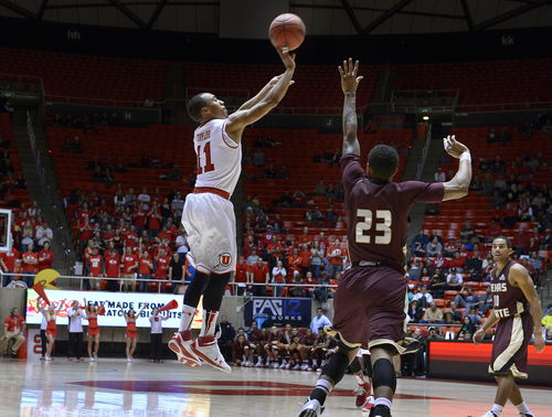 Scott Sommerdorf   |  The Salt Lake Tribune
After Texas State drew to within four points, Brandon Taylor hit this 3-point shot to start a run that sealed the game for the Utes. Utah beat Texas State 69-50, Wednesday December 18, 2013.Scott