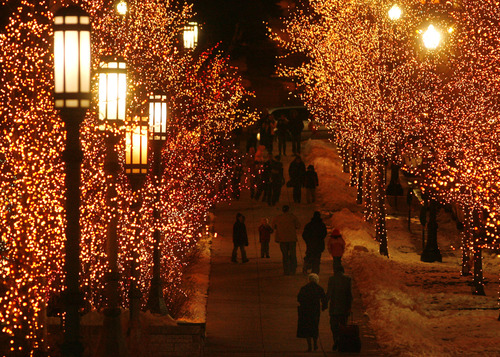 Salt Lake City - The sidewalk on State Street north of Temple Square is illuminated by lights as the holiday season comes to an end Tuesday  December 30, 2008.  The light display on Temple Square will end Jan. 1, 2009. Steve  Griffin/The Salt Lake Tribune 12/30/08