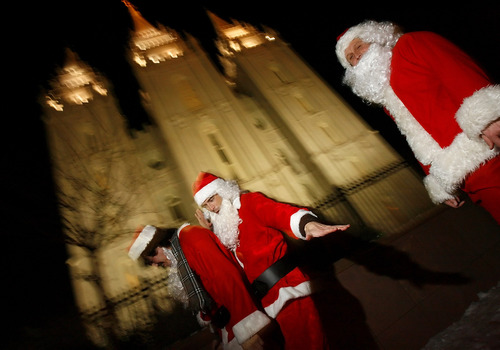 The 2012 SantaCon Salt Lake City pub crawl is Saturday, Dec. 22. In this photo from the crawl on Dec. 16, 2005, Santa Clauses walk through Temple Square during the 10th annual Santa Pub Crawl, where they were eventually asked to leave.

Chris Detrick/Salt Lake Tribune
