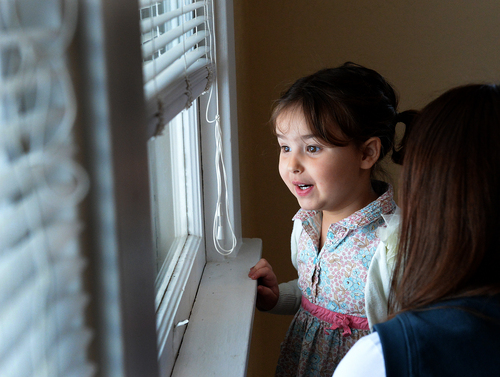 Scott Sommerdorf   |  The Salt Lake Tribune
Three year old Penny Olsen looks out the windiow of the room that will soon be hers at the open house to celebrate the completion of the 100th home rehabilitated by Ogden City's Community Development division in partnership with HUD. The event showcased the City's efforts to address an abundance of foreclosures in the East Central area of downtown Ogden, Wednesday December 18, 2013.