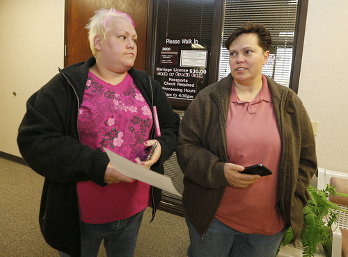 Raylynn Marvel left, and Patsy Carter right, from Orem, Utah, leave the offices of the Utah County Clerk and Auditor office after being rejected for a marriage license on Dec. 20, 2013 in Provo, Utah. A federal Judge on Friday struck down Utah's ban on same sex marriage saying the law violates the U.S. Constitution.  (Photo by George Frey  |  Special to the Tribune)