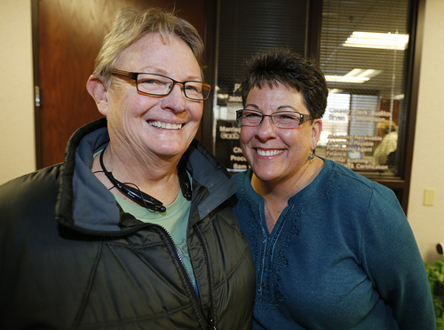 Arlene Arnold left  Loreen Major right from Lehi, Utah, smile as they leave the offices of the Utah County Clerk and Auditor office after receiving a rejection letter for a marriage license on Dec. 20, 2013 in Provo, Utah. A federal judge on Friday struck down Utah's ban on same sex marriage saying the law violates the U.S. Constitution.  (Photo by George Frey  |  Special to the Tribune)