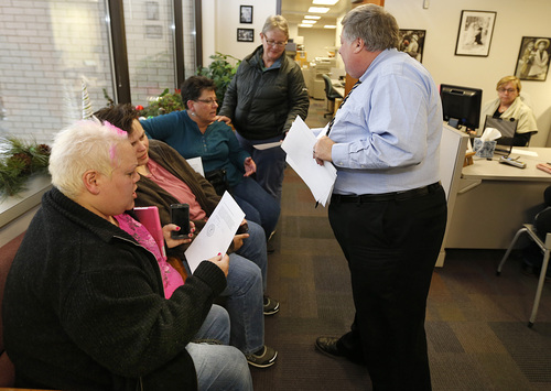 Utah County Clerk and Auditor Bryan Thompson hands out rejection letters for a marriage license to Raylynn Marvel left, Patsy Carter, 2nd left, from Orem, Utah, Loreen Major 2nd right, and Arlene Arnold right, from Lehi, Utah in the offices of the Utah County Clerk and Auditor office on Dec. 20, 2013 in Provo, Utah. A federal Judge on Friday struck down Utah's ban on same sex marriage saying the law violates the U.S. Constitution.  (Photo by George Frey  |  Special to the Tribune)