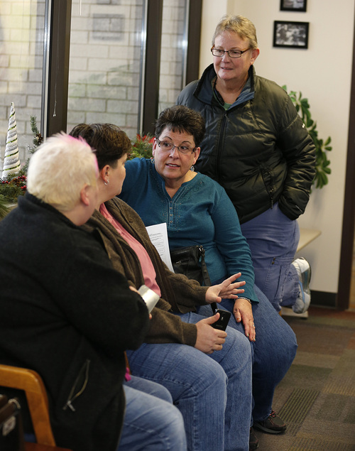 Raylynn Marvel left, Patsy Carter, 2nd left, from Orem, Utah, Loreen Major 2nd right, and Arlene Arnold right, from Lehi, Utah wait in the offices of the Utah County Clerk and Auditor office for word if they will be issued a marriage license as a lesbian couple on Dec. 20, 2013 in Provo, Utah. A Federal Judge on Friday struck down Utah's ban on same sex marriage saying the law violates the U.S. Constitution.  (Photo by George Frey  |  Special to the Tribune)