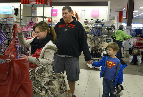 Scott Sommerdorf   |  The Salt Lake Tribune
Scott Stone, with his grandson Oliver in tow, stands by as Stone's daughter Ryan shops at the JC Penney store in the Valley Fair Mall on Saturday.