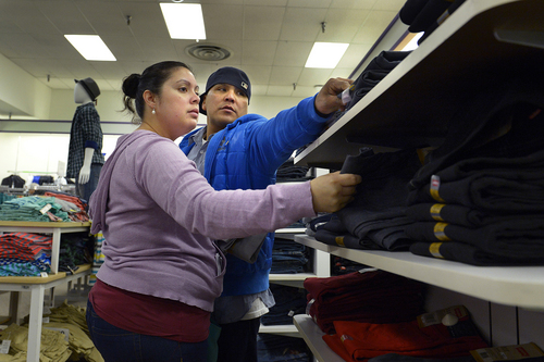 Scott Sommerdorf   |  The Salt Lake Tribune
Maya and Israel Vazquez do some Christmas shopping for their teenage children at the JC Penney store in the Valley Fair Mall, Saturday December 21, 2013.