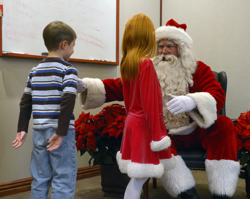 Steve Griffin  |  The Salt Lake Tribune

James Good, 6, and Shayla Brown, 7, meet Santa at VitalSmarts in Provo Friday, December 20, 2013. The founder of the Utah company, Joseph Grenny, is running an experiment with kids and Santa. Grenny, coauthor of the NY Times bestselling book "Crucial Conversations," says the study reveals that how we talk about Christmas can have a big impact on how kids approach gifts, giving and gratitude. Good and Brown were part of a control group during the experiment.