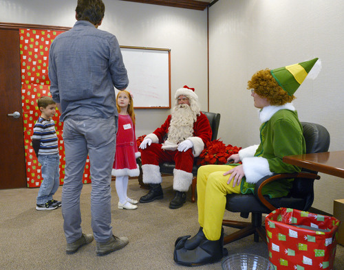 Steve Griffin  |  The Salt Lake Tribune

James Good, 6, and Shayla Brown, 7, meet Santa at VitalSmarts in Provo Friday, December 20, 2013. The founder of the Utah company, Joseph Grenny, is running an experiment with kids and Santa. Grenny, coauthor of the NY Times bestselling book "Crucial Conversations," says the study reveals that how we talk about Christmas can have a big impact on how kids approach gifts, giving and gratitude. Good and Brown were part of a control group during the experiment. Here Chase McMillan, of Vital Smarts, explains to the children their role in the experiment.