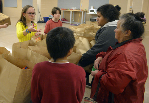 Steve Griffin  |  The Salt Lake Tribune


Rowland Hall seventh graders Annika Pollapsek and Noah Blumenthal help people with bags of food during the annual Christmas Food Giveaway sponsored by Crossroads Urban Center at Rowland Hall School in Salt Lake City, Utah Monday, December 23, 2013. The food giveaway has been going on for decades and it is the 19th year it has been hosted by Rowland Hall. About 1,000 families received food for a Christmas dinner during the day long event.