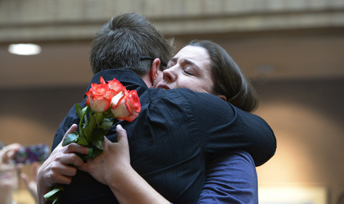 Francisco Kjolseth  |  The Salt Lake Tribune
Emily Holmes, right, embraces her wife Heather Pope after being married in the lobby of the Salt Lake County offices on Monday, Dec. 23, 2013. Hundreds of same-sex couples descended on the Salt Lake offices to request marriage licenses. A federal judge in Utah struck down the state's ban on same-sex marriage last Friday, saying the law violates the U.S. Constitution's guarantees of equal protection and due process.