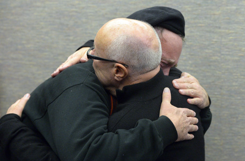 Francisco Kjolseth  |  The Salt Lake Tribune
Doug White, front, embraces his partner of 18-years Kip Swan as the two are married at the Salt Lake County offices on Monday, Dec. 23, 2013. A federal judge in Utah struck down the state's ban on same-sex marriage last Friday, saying the law violates the U.S. Constitution's guarantees of equal protection and due process.