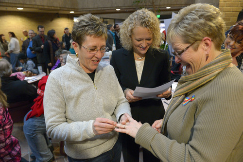 Francisco Kjolseth  |  The Salt Lake Tribune
Joyce Lewallen, left, marries her partner of 20-years Lecia Johnson as Jackie Biskupski officiates on Monday, Dec. 23, 2013. Hundreds of same-sex couples descended on county clerk offices around the state of Utah,  including the Salt Lake County office to request marriage licenses. A federal judge in struck down the state's ban on same-sex marriage last Friday, saying the law violates the U.S. Constitution's guarantees of equal protection and due process.
