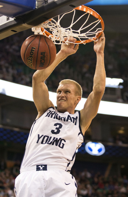Lennie Mahler  |  The Salt Lake Tribune
BYU's Tyler Haws dunks the ball in the first half of a game against Utah State at EnergySolutions Arena in Salt Lake City, Saturday, Nov. 30, 2013.